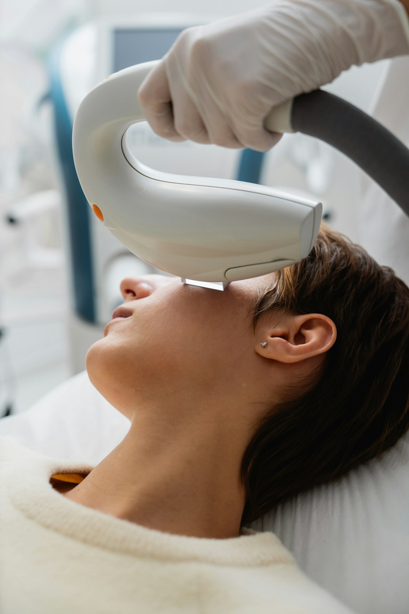 Phototherapy, photorejuvenation, IPL in a beauty salon. Care for a woman's face.