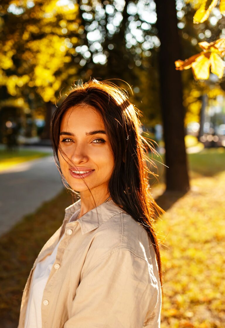 Portrait of beauty woman Enjoying Nature Outdoors. Beautiful autumn model with long hair Image description