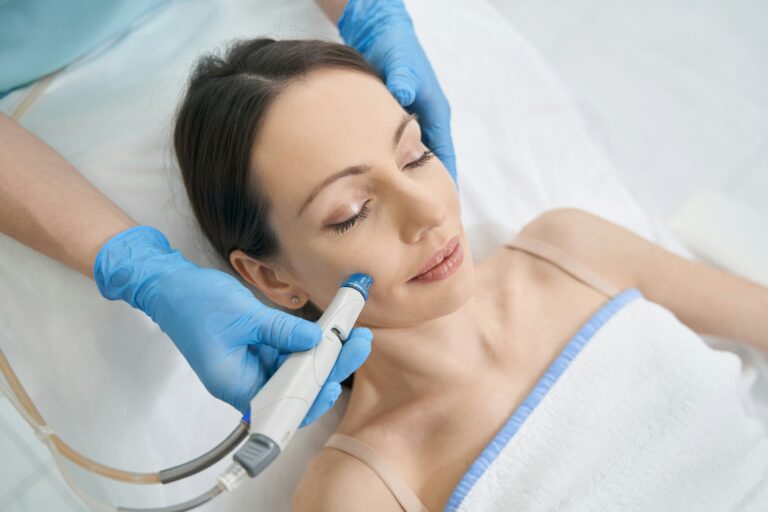 woman-receiving-hydrafacial-treatment-in-beauty-salon Image description